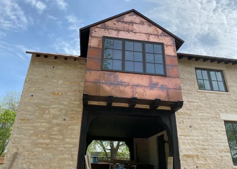 Copper metal panel facade on a stone building for Metal Roof Coating in Vineyard